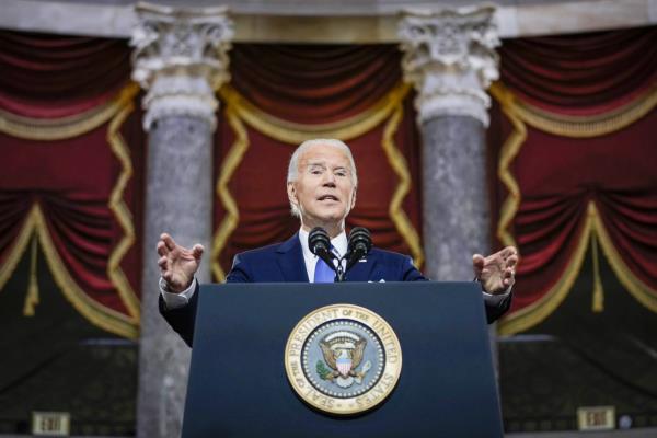 President Joe Biden speaks from Statuary Hall at the U.S. Capitol to mark the one year anniversary of the Jan. 6 riot, Jan. 6, 2022, in Washington.