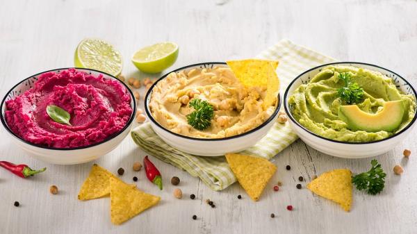 Colorful hummus, different dips, vegan snack, beetroot and avocado hummus, vegetarian eating; Shutterstock ID 1084984733; purchase_order: -; job: -; client: -; other: -